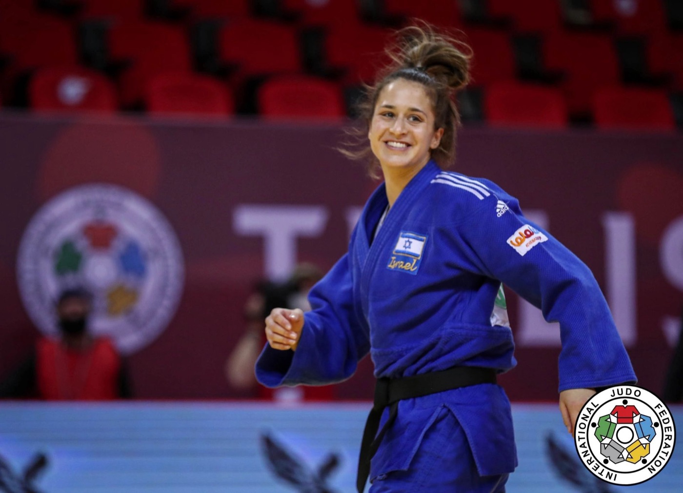 Inbar Lanir smiles in a blue judogi after winning her contest at the 2021 Tbilisi Grand Slam.